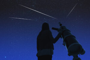 Silhouette of a girl while watching stars through the telescope. Elements of this image are my work.